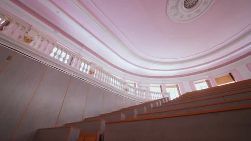 University lecture room without student. Empty university classroom with wooden chairs and desks