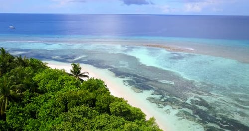 Tropical overhead island view of a paradise sunny white sand beach and aqua turquoise water backgrou