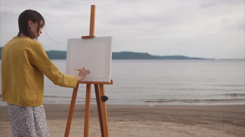 Female Artist Preparing Canvas for Painting on the Bank of the River