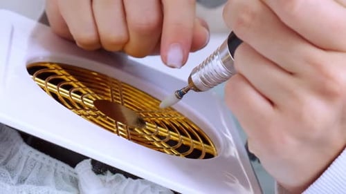 Nail Technician Filing Nail with Drill Tool