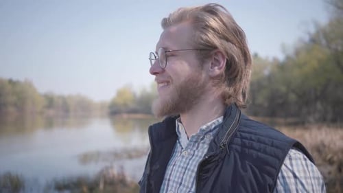Bearded Man Looking at Amazing View of River and Forest