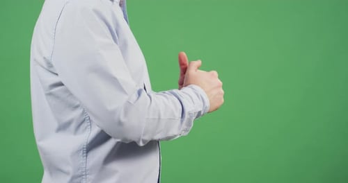 Side view of a man's fists and fingers