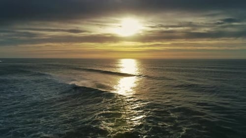 Flying To Setting Sun Over Atlantic Ocean