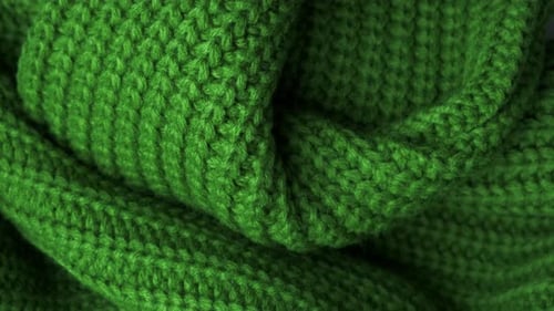 The Texture of the Fabric. Green Knitted Texture. Close-up. Can Be Used As a Background.
