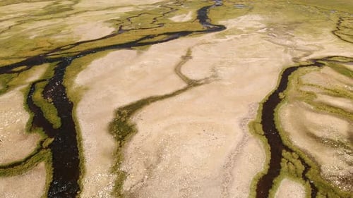 Close Up of Top Aerial View of a Nearly Dry River Crossing Desert in Tajikistan
