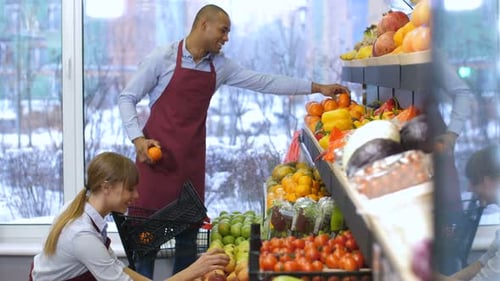 Positive Grocery Store Owners Working at Store