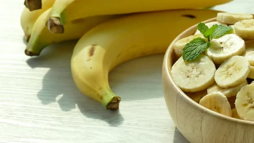 Delicious Bananas and Mint in Wooden Bowl
