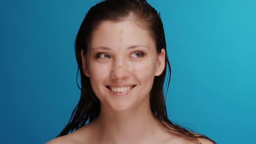 Smiling Woman with Makeup Dots on Face