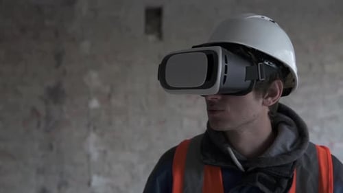 Man in VR Headset and Hardhat Looks Around