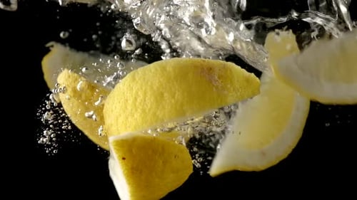 Lemon Slices Falling into Water in Slow Motion