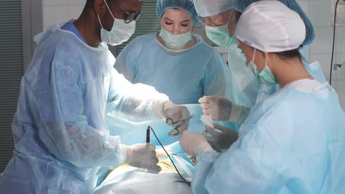 Surgical Team Performs Operation in Hospital Operating Room