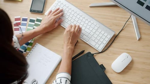 Closeup Slow Motion of Lady's Hand Using Wireless Keyboard Typing Working with Pc in Office
