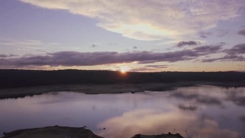 Sun rising over peaceful swamp