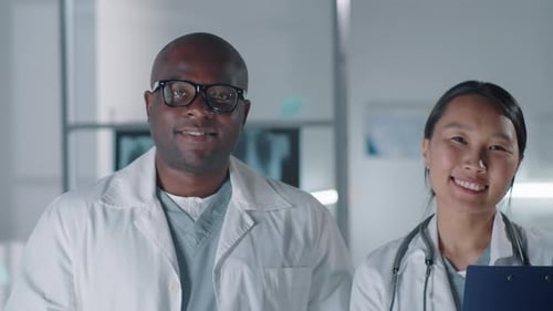 Cheerful Doctors Looking At Camera