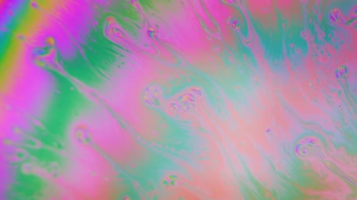 Gotas de color flotando y arremolinándose en reacción. Fondo de toma macro