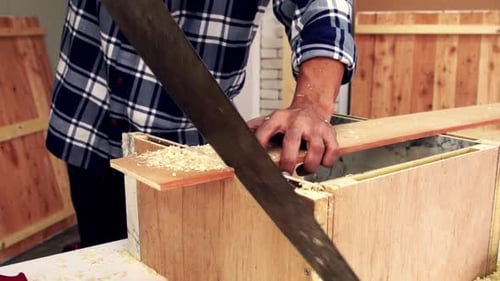 Carpenter Working on Wood Craft at Workshop