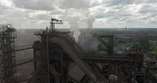Epic Aerial of Pipes with White Smoke Emission. Plant Pipes Pollute Atmosphere. Industrial Factory