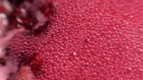 Raspberry syrup. Pink background with bubbling bubbles and raspberries.