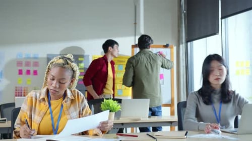 Couple of young female ux ui designers working at modern office