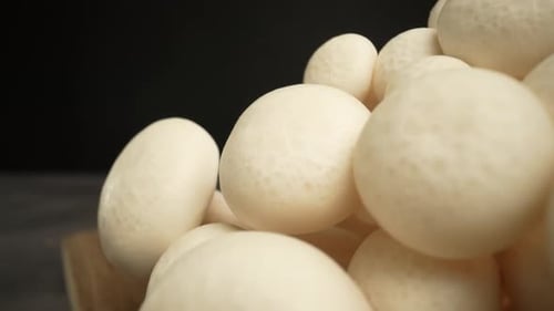 Close Up of White Beech Mushrooms on Board