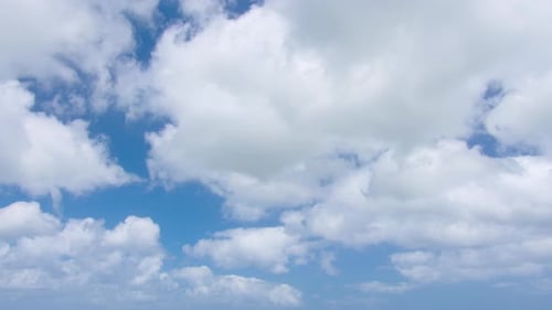 Blue Sky with Fluffy White Clouds Aerial View