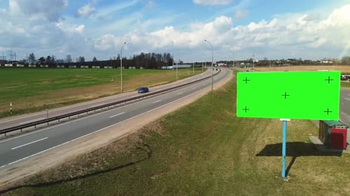 Aerial footage billboard poster with green screen and tracking markers.