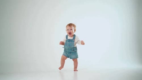baby 10 months first successful steps, but not solved. studio slow motion