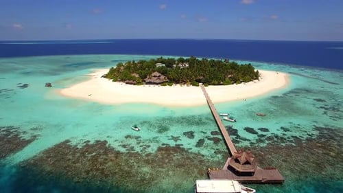 Aerial drone view of a scenic tropical island in the Maldives