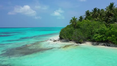 Aerial drone shot tourism of perfect seashore beach vacation by transparent water with white sand ba