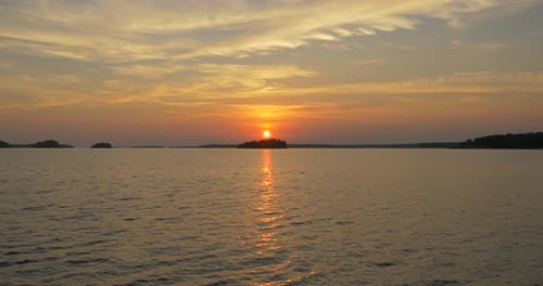 Golden Sunset Over Calm Lake Waters