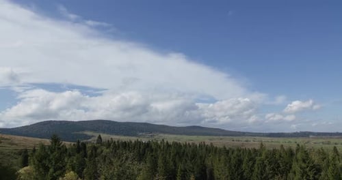 Meadow Timelapse at the Summer or Autumn Time. Wild Nature and Rural Field. Clouds Over Mountain