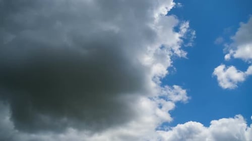 Dramatic Clouds Moving Across a Bright Blue Sky