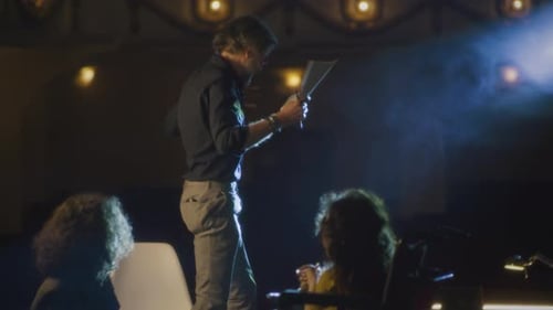 Director Working with Actors on Dark Stage