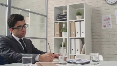 Business Team Attends Presentation in Modern Office