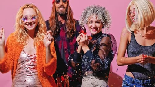 Happy Young Adults Celebrating with Confetti