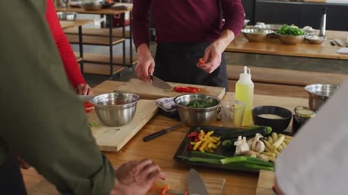 Adults Prepping Colorful Vegetables in Cooking Class