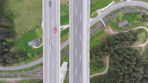 Aerial Top View of Highway Viaduct with Multilane Traffic in Mountains. Autobahn in Austria