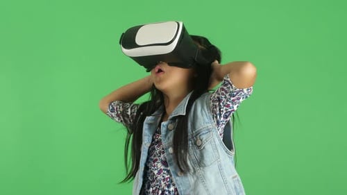 Young Girl Wearing VR Headset Expressing Surprise