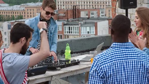 Friends Celebrate at a Rooftop Party with DJ