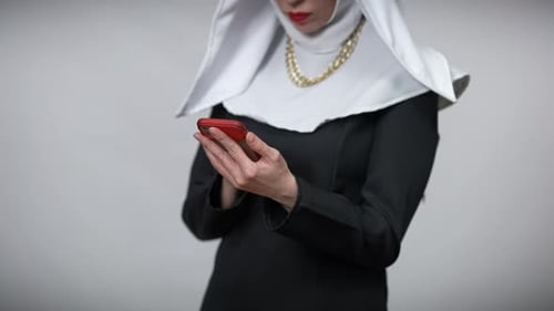 Nun Uses Cellphone in Modern Times