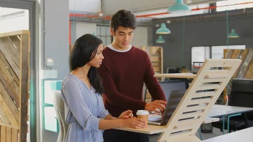Executives discussing over laptop in the office 4k