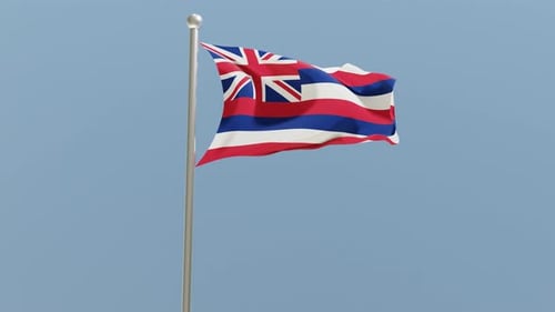 Waving Hawaiian Flag on a Pole Against Blue Sky
