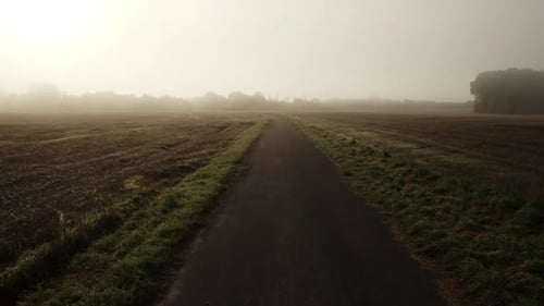 Drone Flight Along Empty Footpath And Fields