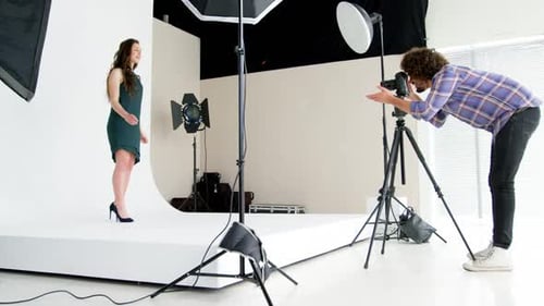 Female Model Posing for Photographer in Studio