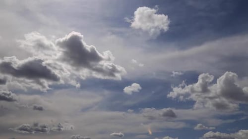 Dramatic Clouds Moving Across the Blue Sky