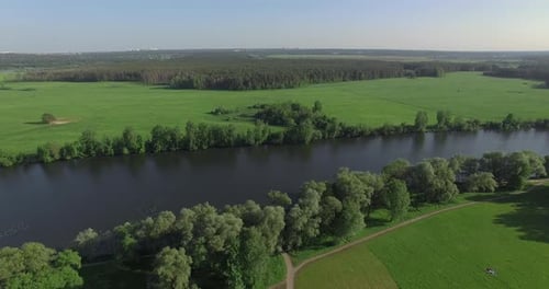 A River Among Fields and Forests