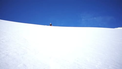 Slow Motion Man Skiing in Powder Snow