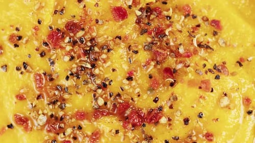 Close Up of Yellow Puree with Sprinkled Toppings