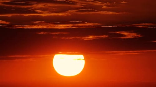 Vibrant Sunrise with Fiery Sky and Clouds