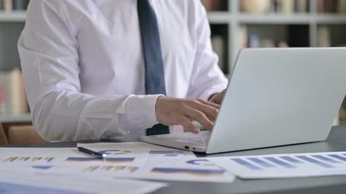 Close Up Shoot of Businessman Using Laptop on Office Desk